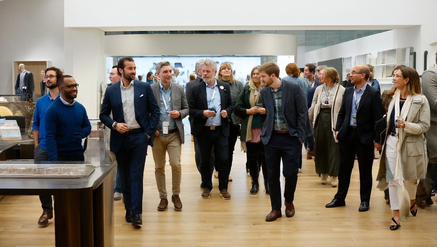Prospective buyers reviewing an architectural model at a presentation centre
