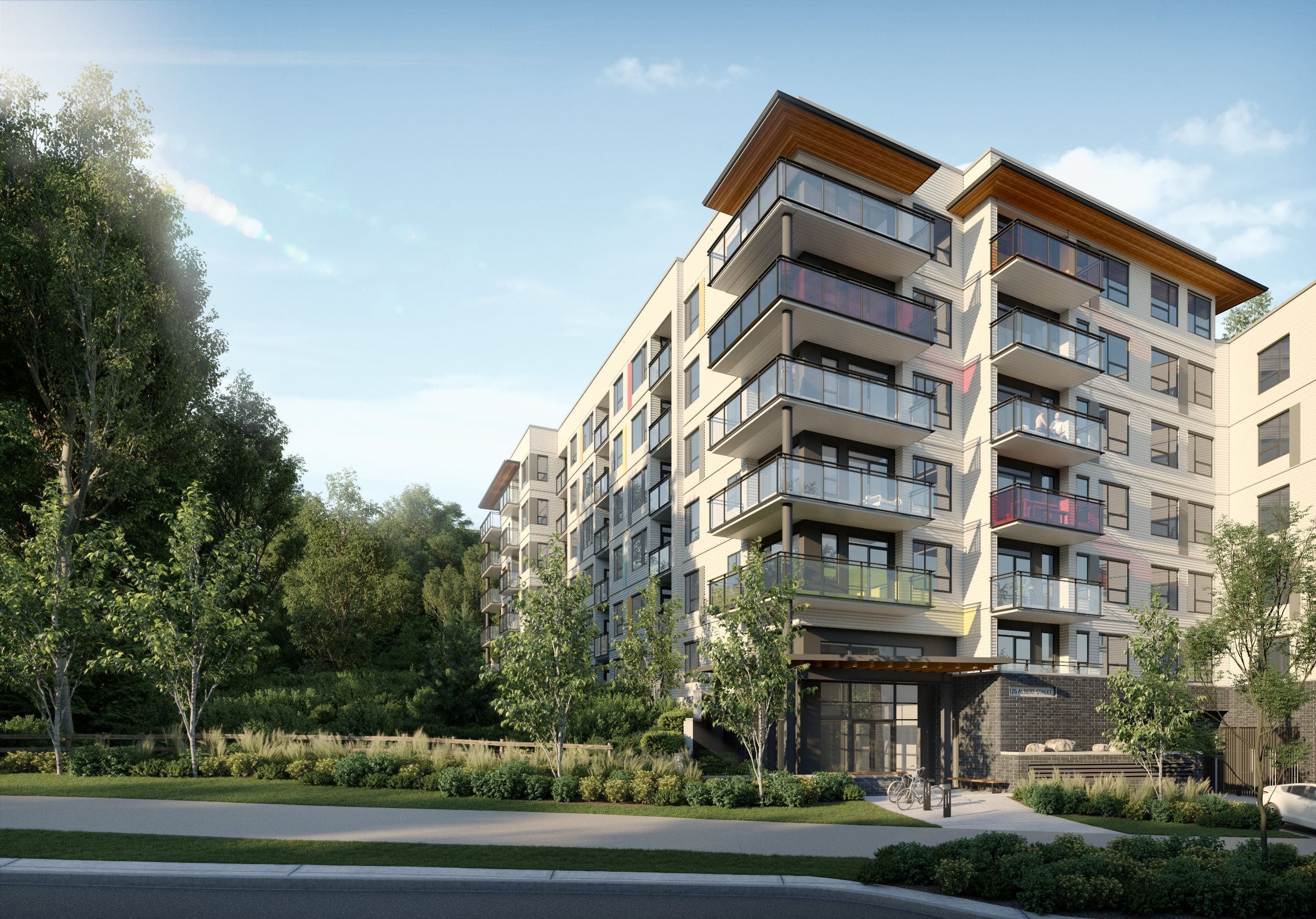 Evening rendering of Hue by Marcon with lit corner cafe in Port Moody